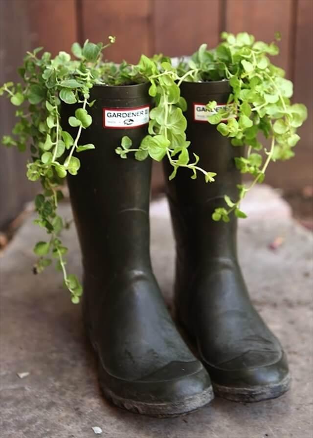 This rustic collection of boot planters are full of colourful flowers that bring a wall space to life.
