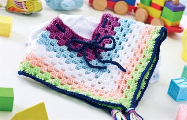 Cheerful crochet baby poncho