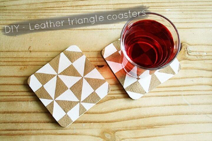 coasters, scraps of faux leather in two colors, textile glue, scissors, small piece of cardboard or paper, pen.