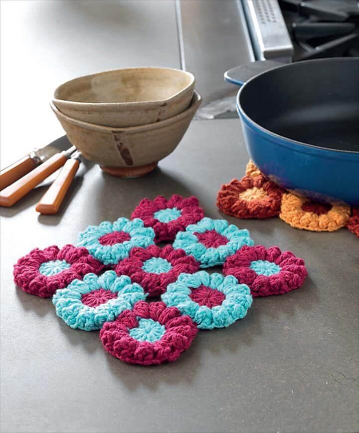 Secondly and thirdly are these homey items: flowering trivets and color block ottoman.