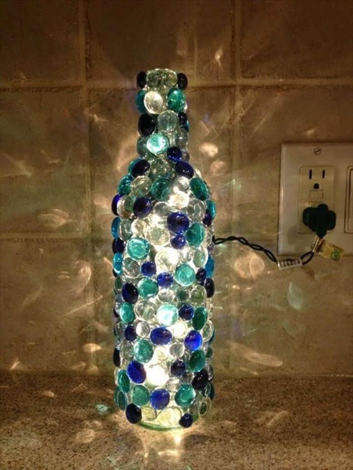 Glue glass beads to an old wine bottle to recreate this stunning design.