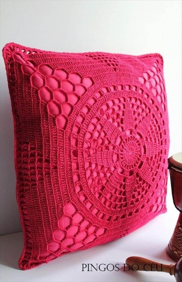 rasberry pink crochet covered cushion, could dye my doylies and do this