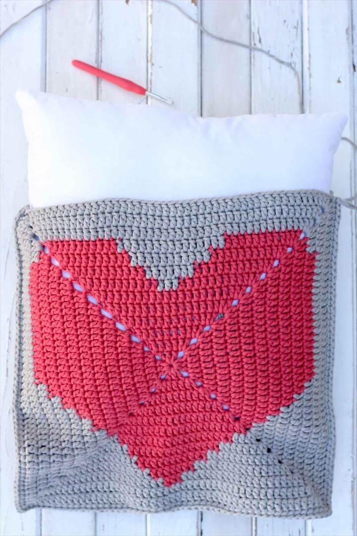 This free crochet pillow pattern with a modern heart makes a perfect DIY gift or dorm