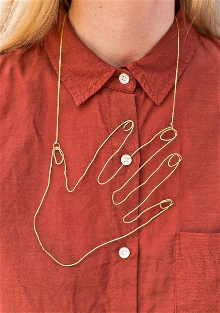 a wire hand necklace that you'll never want to take off