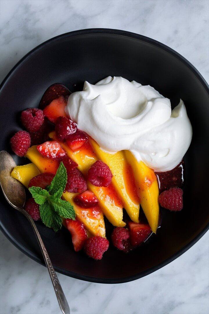 Whipped Cream Served with Fresh Mangoes Strawberries and Raspberries