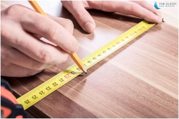 Take the measurements of the tabletop